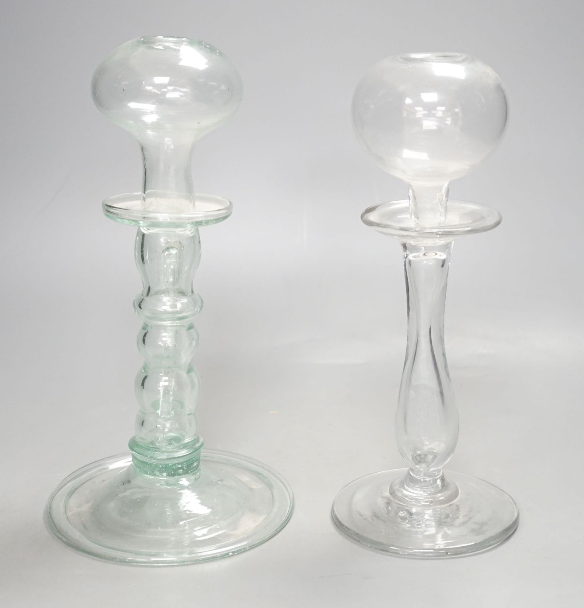 Two 19th century glass lacemaker's lamps, 25cm